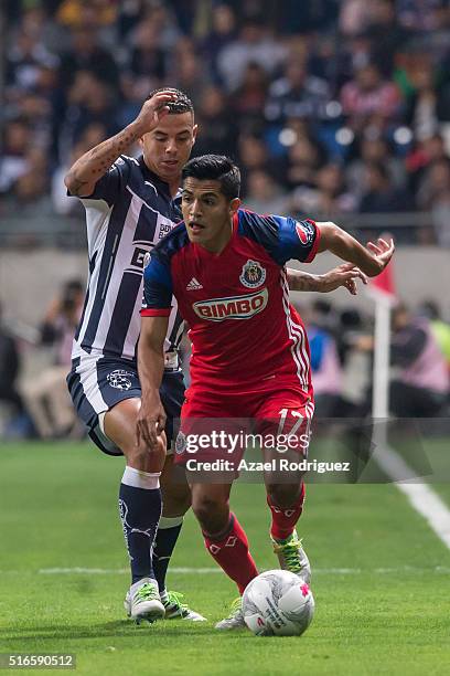 Edwin Cardona of Monterrey fights for the ball with Jesus Sanchez of Chivas during the 11th round match between Monterrey and Chivas as part of the...