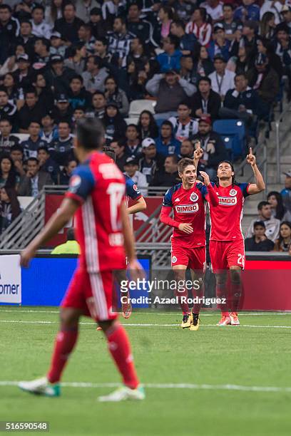 Carlos Peña of Chivas celebrate with teammates after scoring his team's first goal during the 11th round match between Monterrey and Chivas as part...