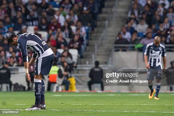 Rogelio Funes Mori and Carlos Sanchez of Monterrey react after receiving a goal during the 11th round match between Monterrey and Chivas as part of...