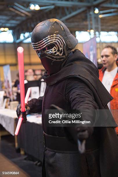 An atendee at Comic Con 2016 in cosplay as Kylo Ren from Star Wars: The Force Awakens on March 19, 2016 in Birmingham, United Kingdom.