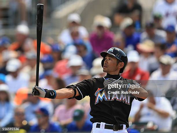 Ichiro Suzuki of the Miami Marlins prepares for an at bat during the spring training game against the New York Mets on March 15, 2016 in Jupiter,...