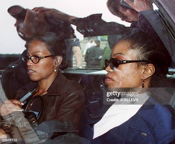 Qubilah Shabazz and her sister Illayasah wait in a car 03 June outside family court in Yonkers after attending a court hearing for Qubilah's son...