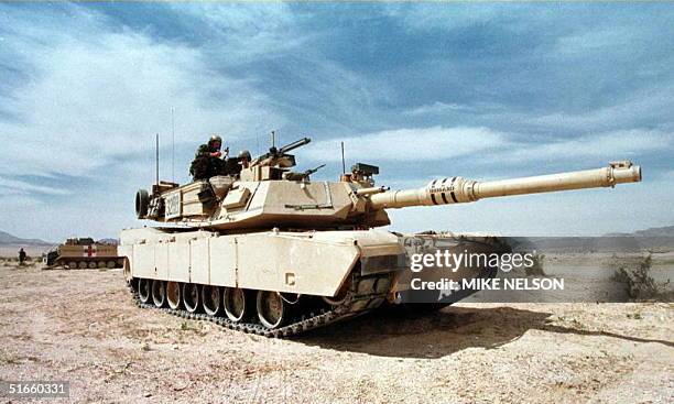 An M-1A1 Abrams tank guards a position during the Advance Warfighting Experiment at the Fort Irwin Army National Training Center in Fort Irwin, CA,...