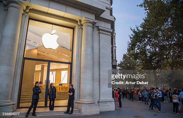 First day of the IPhone 6 and IPhone 6 Plus release in Spain with the first buyers waiting outside in a line in the Barcelona's city Apple Store....