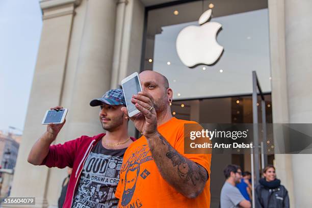 First day of the IPhone 6 and IPhone 6 Plus release in Spain with the firsts buyers in the Barcelona's city Apple Store. September 26th of 2014....