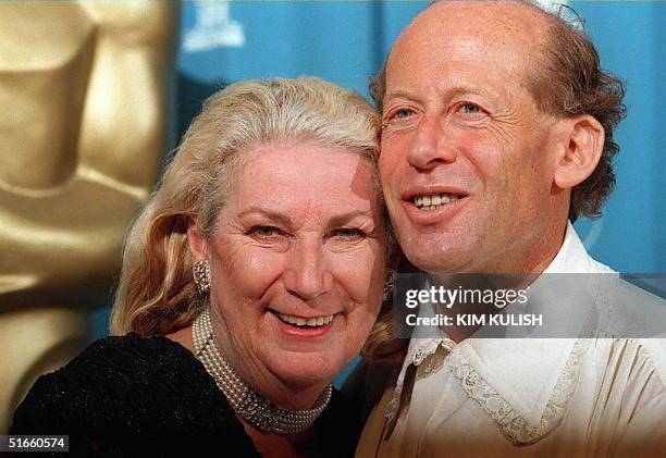 Australian pianist David Helfgott and his wife Gillian pose for photographers during the 69th Academy Awards ceremony at the Shrine Auditorium in Los...