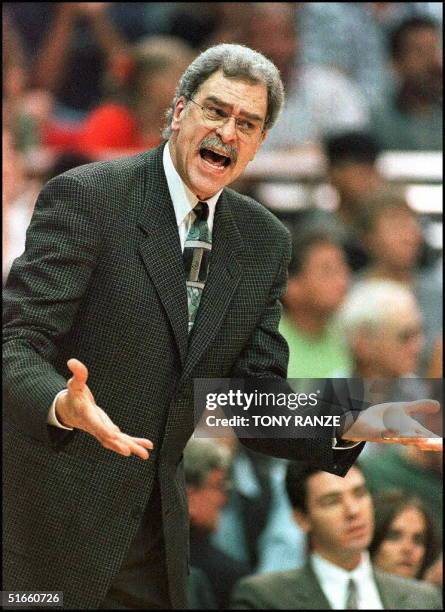 Chicago Bulls head coach Phil Jackson reacts as he is called for a technical foul after arguing a call with an offical during the first period of...