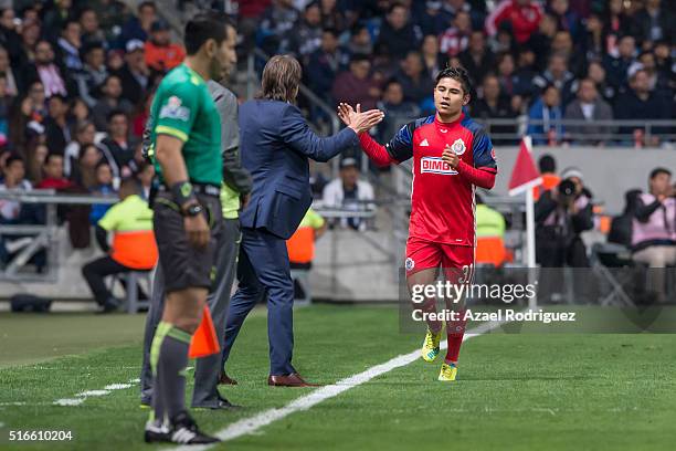 Javier Lopez of Chivas celebrate with coach Matias Almeyda after scoring his team's third goal during the 11th round match between Monterrey and...