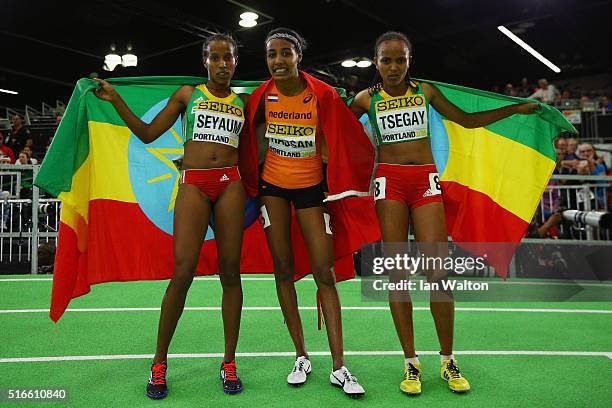 Silver medallist Dawit Seyaum of Ethiopia, gold medallist Sifan Hassan of the Netherlands and bronze medallist Gudaf Tsegay of Ethiopia pose after...