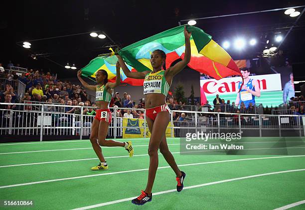 Silver medallist Dawit Seyaum of Ethiopi and bronze medallist Gudaf Tsegay of Ethiopia celebrate after the Women's 1500 Metres Final during day three...