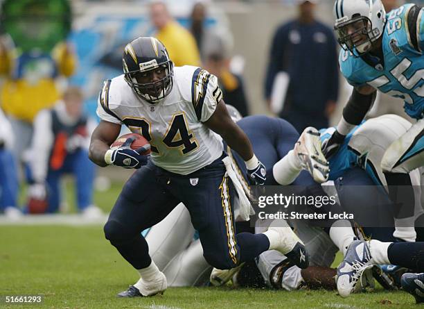 Jesse Chatman of the San Diego Chargers runs the ball against the Carolina Panthers during their game on October 24, 2004 at Bank of America Stadium...