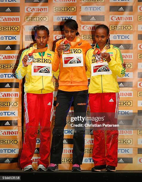 Silver medallist Dawit Seyaum of Ethiopia, Gold medallist Sifan Hassan of the Netherlands and bronze medallist Gudaf Tsegay of Ethiopia pose on the...