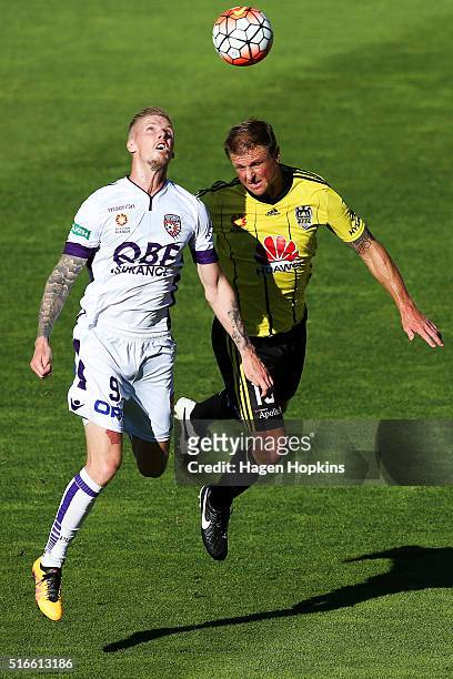 Andy Keogh of the Glory and Ben Sigmund of the Phoenix compete for a header during the round 24 A-League match between the Wellington Phoenix and the...