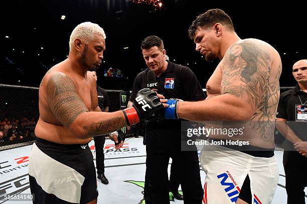 Mark Hunt of New Zealand and Frank Mir of the United States touch gloves before their heavyweight bout during the UFC Fight Night event at the...