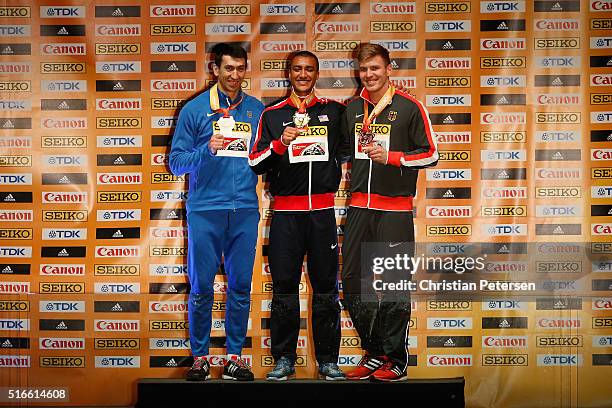 Silver medallist Oleksiy Kasyanov of Ukraine, gold medallist Ashton Eaton of the United States and bronze medallist Mathias Brugger of Germany pose...