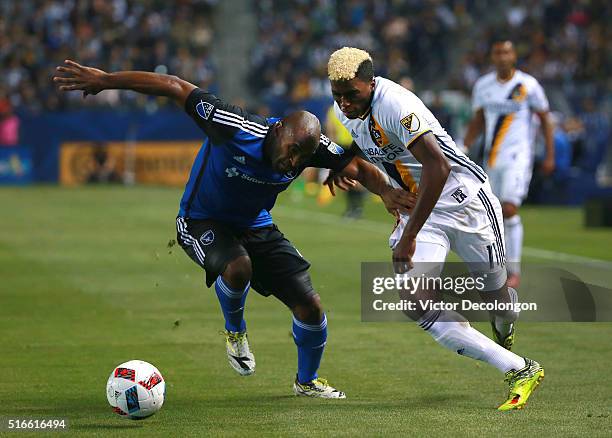 Gyasi Zardes of the Los Angeles Galaxy and Marvell Wynne of the San Jose Earthquakes vie for position to the ball during the second half of their MLS...