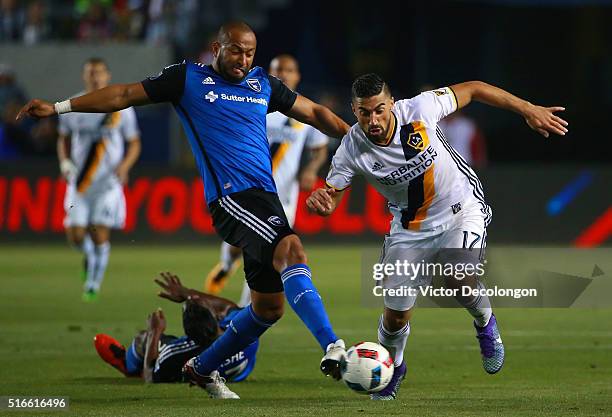 Victor Bernardez of the San Jose Earthquakes plays the ball clear from Sebastian Lletget of the Los Angeles Galaxy during the second half of their...