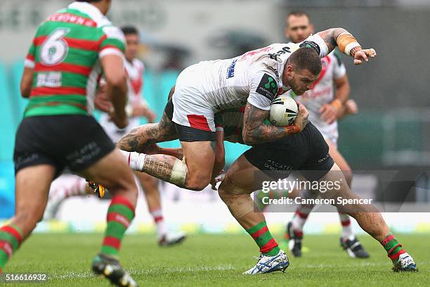 Josh Dugan of the Dragons is tackled during the round three NRL match between the St George Dragons and the South Sydney Rabbitohs at Sydney Cricket...