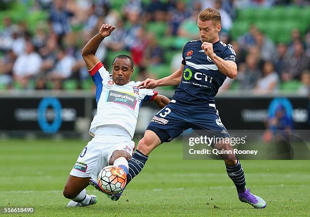 Leonardo Santiago of the Jets and Oliver Bozanic of the Victory compete for the ball during the round 24 A-League match between the Melbourne Victory...