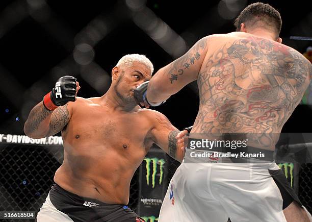 Mark Hunt throws a punch against Frank Mir during their UFC Heavyweight Bout at UFC Brisbane on March 20, 2016 in Brisbane, Australia.
