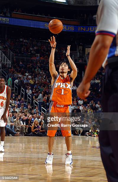 Yuta Tabuse of the Phoenix Suns scores the first point by a player from Japan in an NBA game against the Atlanta Hawks on November 3, 2004 at America...