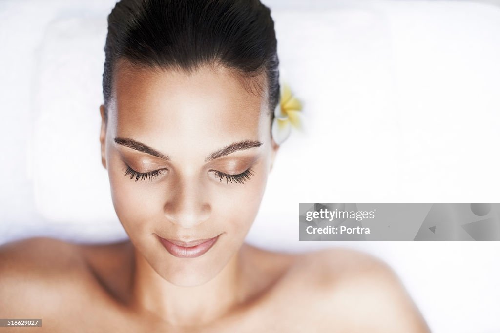 Beautiful woman lying on massage table