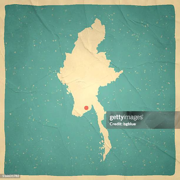 myanmar map on old paper - vintage texture - myanmar stock illustrations