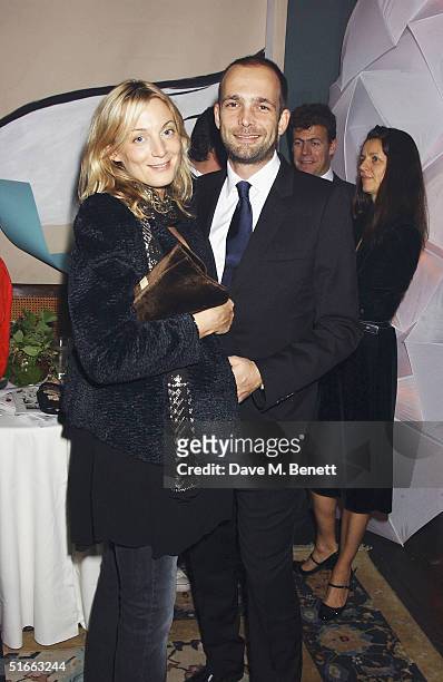 Creative Director of Chloe Phoebe Philo and partner artist Max Wigram attend the Vogue and Motorola Private VIP Party, launching Vogue's December...
