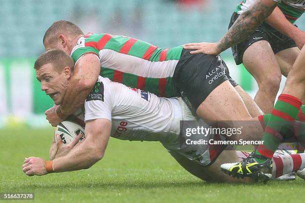 Ben Creagh of the Dragons is tackled during the round three NRL match between the St George Dragons and the South Sydney Rabbitohs at Sydney Cricket...