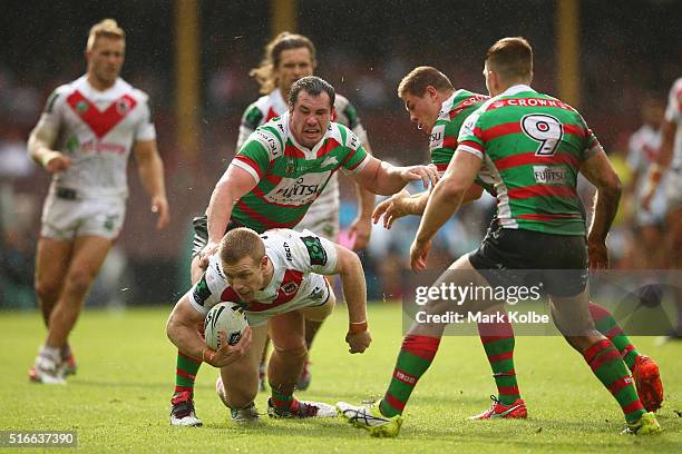 Ben Creagh of the Dragons is tackled during the round three NRL match between the St George Dragons and the South Sydney Rabbitohs at Sydney Cricket...