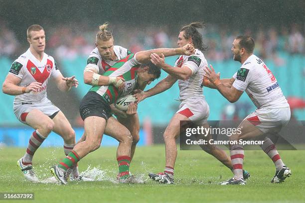 Bryson Goodwin of the Rabbitohs is tackled during the round three NRL match between the St George Dragons and the South Sydney Rabbitohs at Sydney...