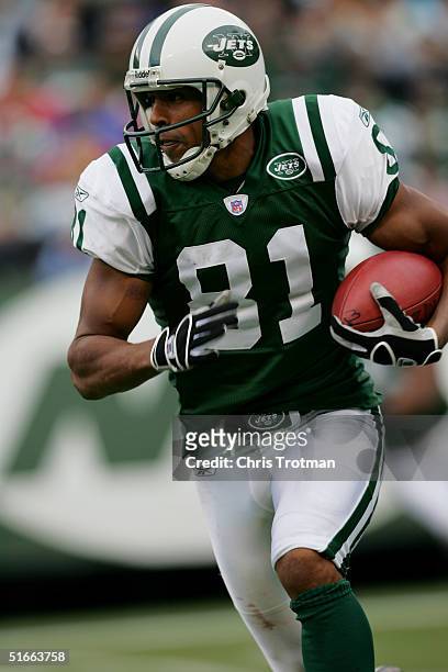 Wide receiver Justin McCareins of the New York Jets runs with the ball during a game against the San Francisco 49ers at Giants Stadium on October 17,...