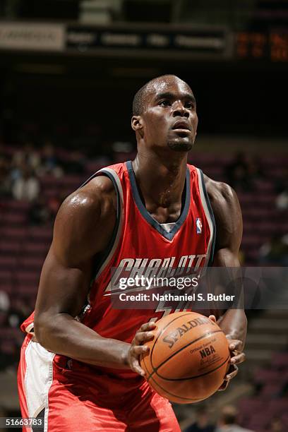 Emeka Okafor of the Charlotte Bobcats prepares to shoot a free-throw during a preseason game against the New Jersey Nets at the Continental Airlines...