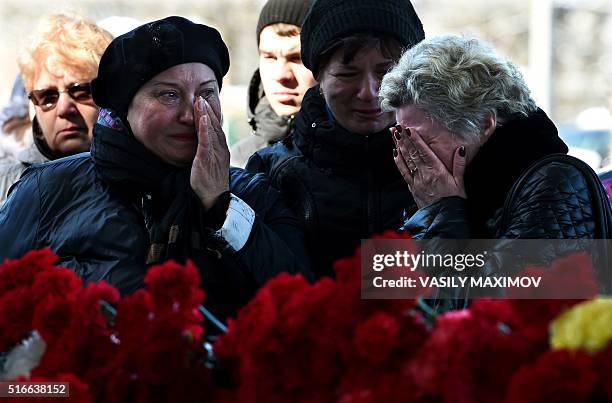 Women cry at the Rostov-on-Don airport entrance on March 20, 2016. A flydubai passenger Boeing jet crashed early Saturday as it attempted to land in...