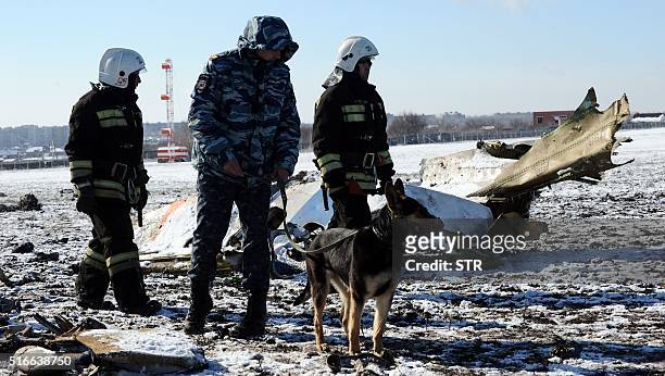 Russian Emergency Ministry rescuers search the wreckage of a crashed airplane at the Rostov-on-Don airport on March 20, 2016. A flydubai passenger...
