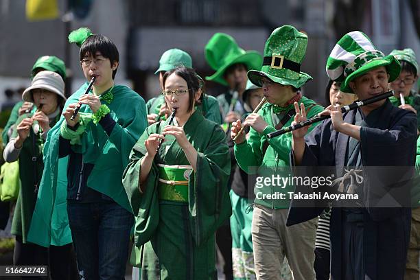 Participants march on the Omotesando Avenue during the 24th annual St. Patrick's Day Parade on March 20, 2016 in Tokyo, Japan. According to the...