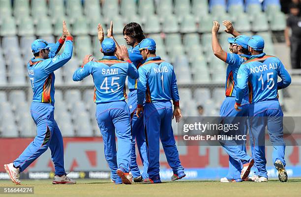Mumbai, INDIA Shapoor Zadran of Afghanistan celebrates the wicket of Hashim Amla of South Africa during the ICC World Twenty20 India 2016 match...
