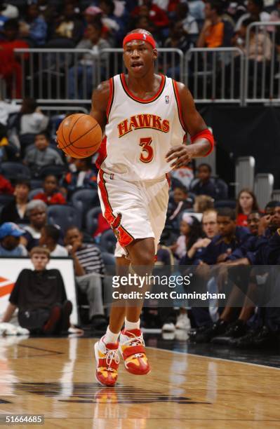 Al Harrington of the Atlanta Hawks brings the ball upcourt against the Memphis Grizzlies during the preseason game on October 20, 2004 at Philips...
