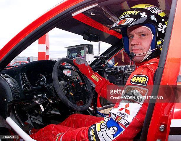 Four-time WRC overall champion Tommi Makinen of Finland shows his driving skill before Japanese fans during a demonstration run with the Mitsubichi...