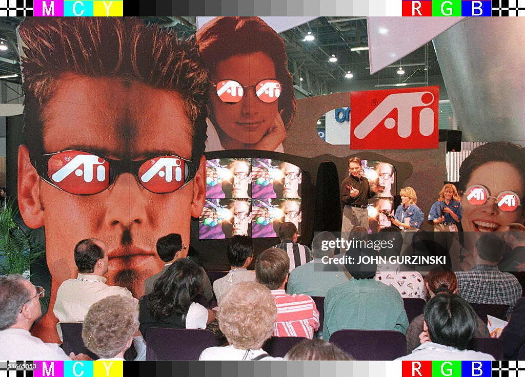 Conventioneers flood the ATI Technologies booth on