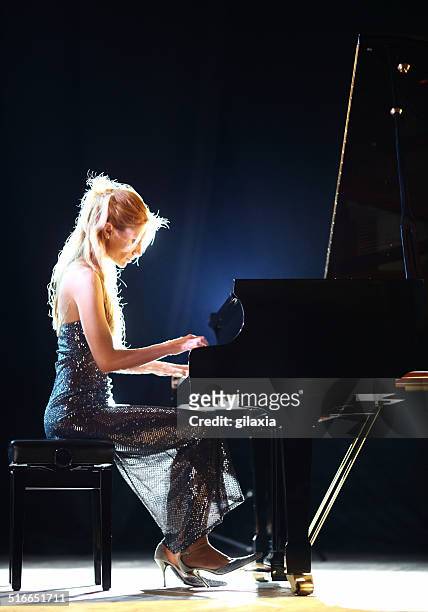 female pianist in a concert. - soloist stock pictures, royalty-free photos & images