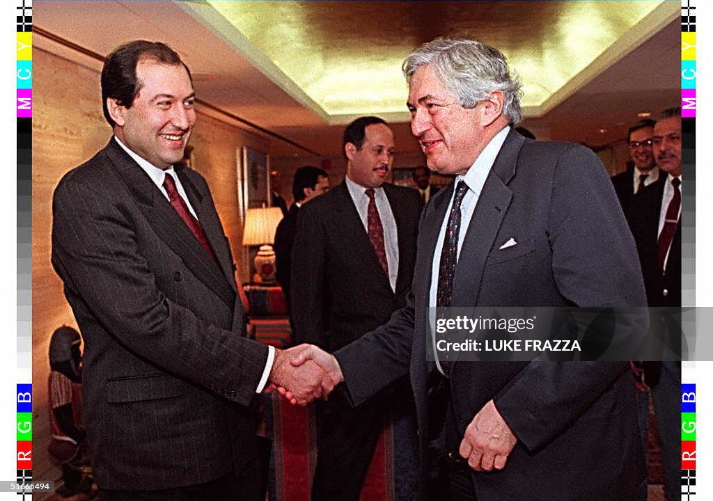 World Bank President James Wolfensohn (R) greets A