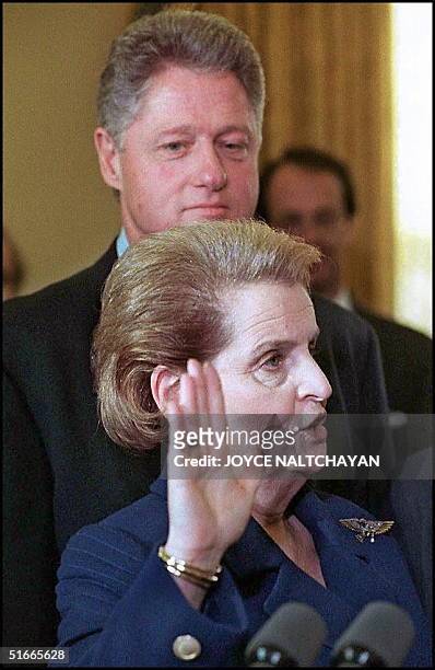 Former UN Ambassador Madeleine Albright is sworn in as the new US Secretary of State as President Bill Clinton looks on during ceremonies at the...