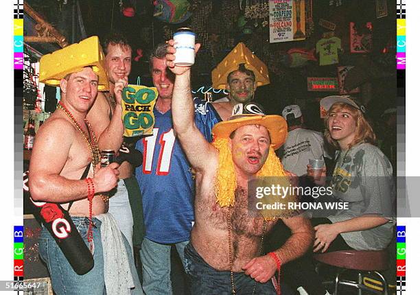 Football fans from Green Bay and New England crowd a Bourbon Street bar in New Orleans, Louisiana, 24 January as football fans from around the US...