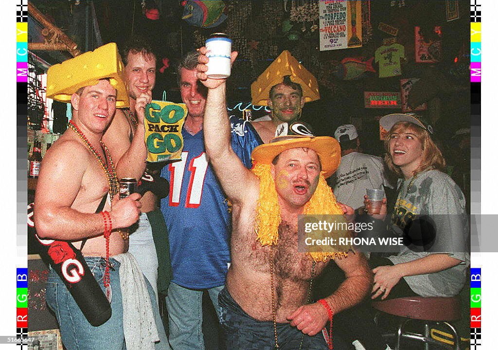 Football fans from Green Bay and New England crowd