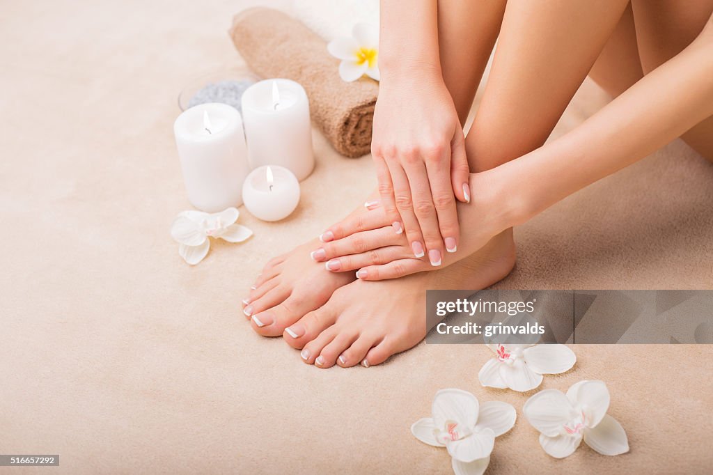 Woman at spa with done manicure and pedicure