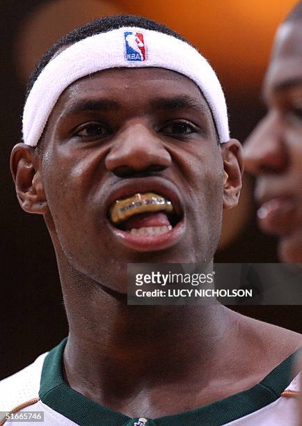St. Vincent-St. Mary's LeBron James eyes opponent, Mater Dei's D.J. Strawberry, during their game in Los Angeles, CA, 04 January 2003. St....