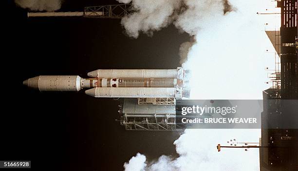 The Titan 4B launch vehicle blasts off launch pad 40 at Cape Canaveral Air Force Station, FL, 15 October, carrying the Cassini spacecraft into to...