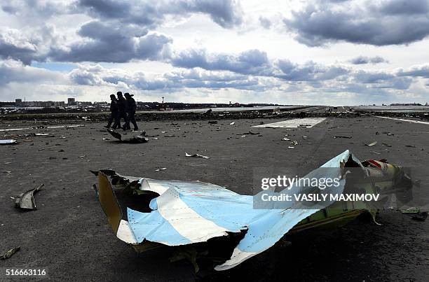 Russian Emergency Ministry rescuers examine the wreckage of a crashed airplane at the Rostov-on-Don airport on March 20, 2016. Investigators in...