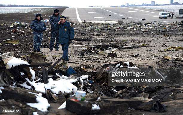 Russian Emergency Ministry rescuers examine the wreckage of a crashed airplane at the Rostov-on-Don airport on March 20, 2016. Investigators in...